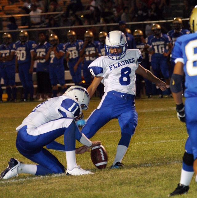 Ernesto Ballesteros # 8 kicks a PAT for 2 points. Also pictured is Corey Cole, Cole Quarterback for Fillmore,
was 8 of 14 for 137 yards and 1 touchdown.