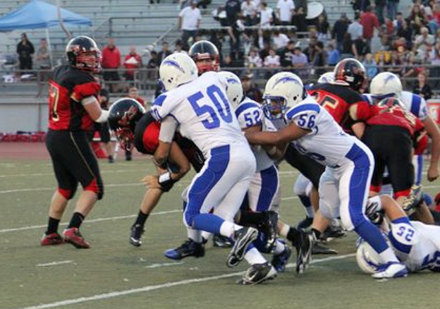Above Johnny Wilber #50, Sammy Orozco #52, and Mazrco Vega #56 work to bring down a Villiage Christian player. Fillmore lost 21-41. Brandon Pina, Orozco, Daniel Cruz, and Jeremy Martinez all accounted for nine sacks in the first half. Coach Dollar stated,“ We still have yet to string four quarters of good football together, two good quarters or even three is not enough to win games”.
