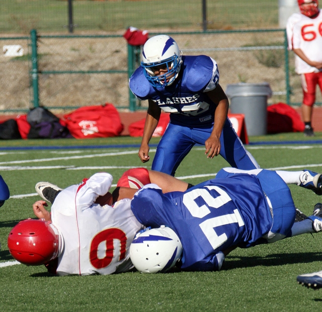 Jeremy Martinez #72 (J.V) tackles Village Christian player #9, during Friday night’s football game.