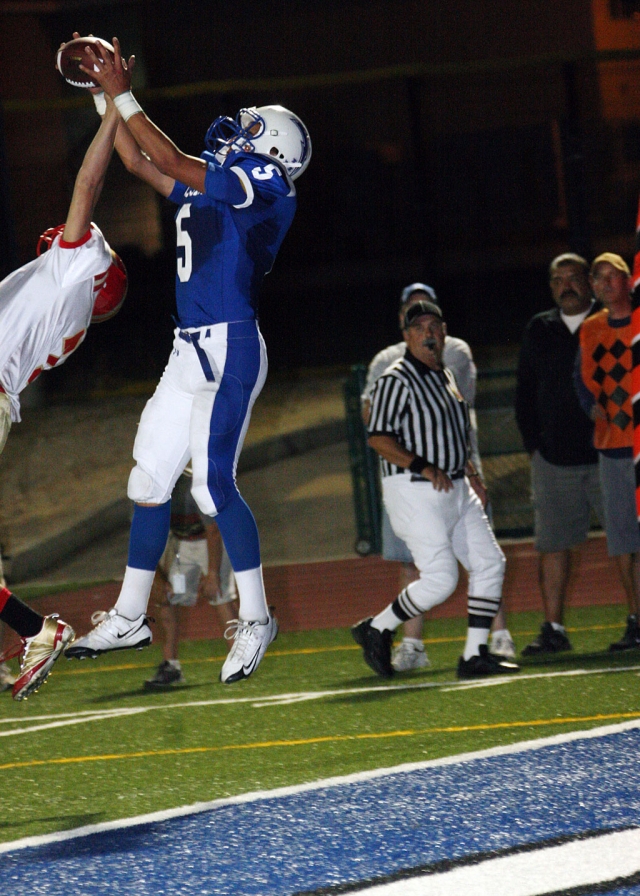 Chris De La Paz jumps to catch a pass thrown by quarterback Corey Cole for a touchdown.