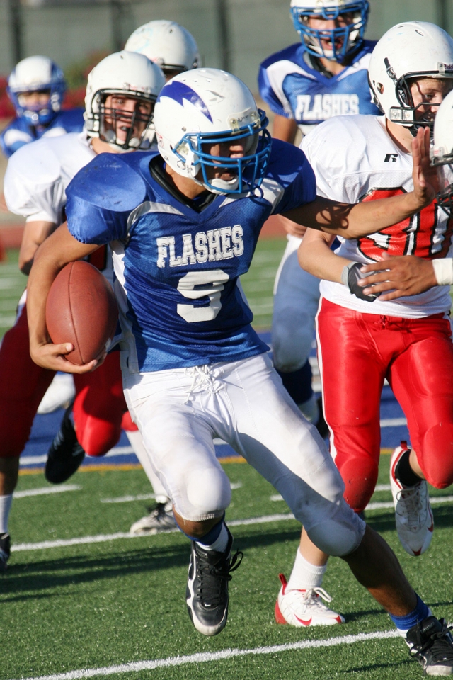 Nathan Garnica #9 tries to avoid being tackled by Carpinteria, Garnica had one touchdown last Friday.