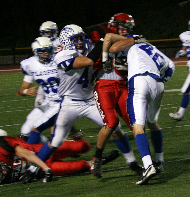 Tony Cortez #44 and Tate Suttle #40 bring down a Lancer.