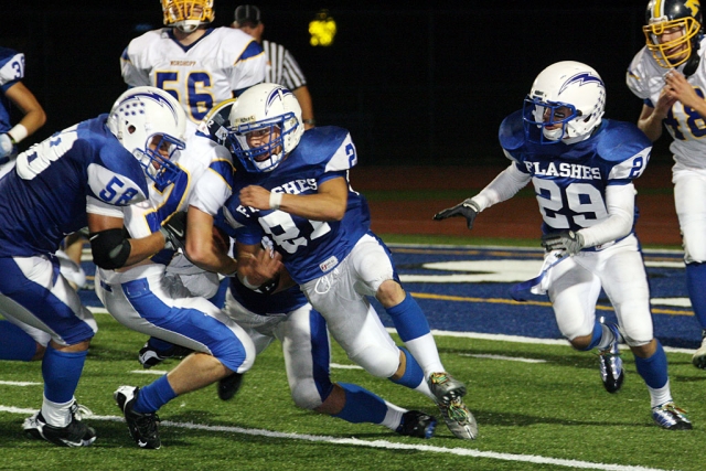 Derek Luna #58 opens the gap for Nick Paz #21 for a few yards. Luna had 11 tackles and Matt De La Cruz had 12 against Nordoff. According to Coach Dollar “This was a tough Nordoff team and 4 fumbles didn’t help, now we need to get ready for league”. Flashes first league game is this Friday against Villanova at home. Football Photos Courtesy Crystal Gurrolla.