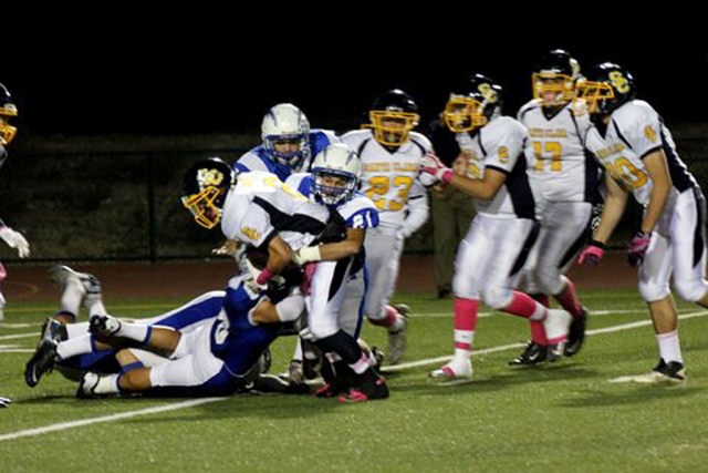 (above) Nick Sanchez (#21), with the help of his teammates, take down the runner. Fillmore Varsity defeated Santa Clara 41,7. Collin Farrar ran for over 190 yards and three touchdowns. Andrey Sanchez ran for over 100 yards and had a touchdown pass reception. Carson McLain threw for over 165 yards and two touchdowns. The Flashes had over 500 yards of offense. “Both the offense and the defense played solid, we need to have to have great practices to continue the momentum.” Fillmore JV defeated Santa Clara 62,0. JV Flashes open Frontier league with a win over the Santa Clara Saints. On offense the Flashes had 7 different players score touchdowns led by freshman Bryce Farrar and Vincent Whittaker with 2 TD’s,  also scoring for the Flashes were Michael Luna, Jorge Andrade, Nick Liu, Damien Gonzalez, and Joseph Magana, who was 8 for 8 on his P.A.T. attempts. Quarterback Carlos Brecino was 4 of 5 throwing for 102 yards and 2 TD’s. The offensive line did a amazing job at blocking for the running backs, they are led by Chad Petuoglu, Michael Castro, Michael Townead, Jarred Warren, Emilio Hernandez, and Wes Breechen. On Defense Daniel Flores Help set the temp for the flashes and helping stop the saints from scoring.