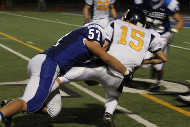 Juan Moreno (#57) tackles Santa Clara runner during last Friday’s game.
