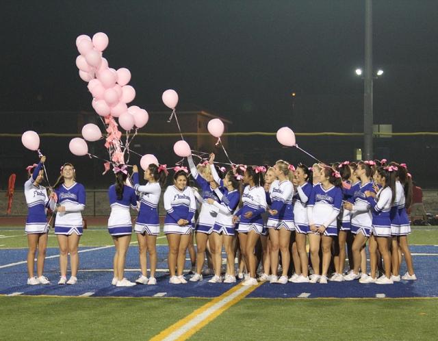 Fillmore Flashes cheerleaders release pink balloons at the game’s halftime Friday night in honor is October Breast Cancer Awareness month.