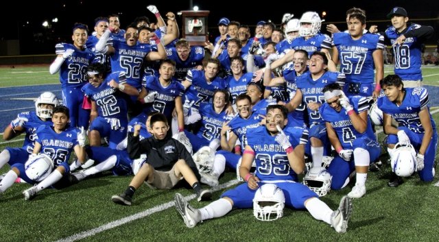 On Friday, October 19th the 108th meeting of long time rivals Fillmore & Santa Paula took place and the Flashes beat the undefeated Santa Paula team 31 – 24. Pictured is the Varsity team hoisting the leather helmet and smiling in celebration of their win. Photos courtesy Crystal Gurrola.