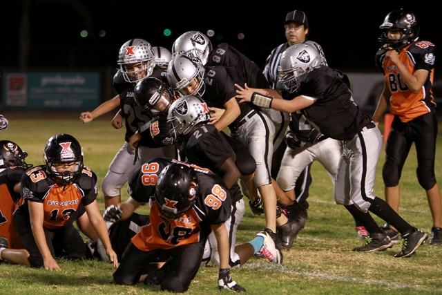 Fillmore Raiders J2 took the GCYFL Championship over Ventura 30 to 16, Saturday, November 9, 2013. Winning team members are #00 Eric Gonzalez, #5 Guillermo Calderon, #20 Ricky Holladay, #21 Ramon Eskridge, #23 David Tovar, #25 Freddy Rodriguez, #28 John Roberts, #32 Vincent Castillo, #34 Trevor Scott, #45 Marshall Martinez, #52 Julian Calderon, #72 Rafa Meza, #75 Connel Ferguson, #97 Benjamin Velasco and #99 Jose Romero. Raiders’ photos courtesy Harold Cronin.