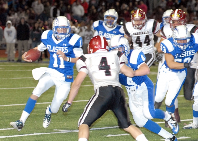 Corey Cole #11 Quarterback for the Flashes runs the ball for a few yards. Cole was 6 of 13 passes for 142 yards and two passing touchdowns.