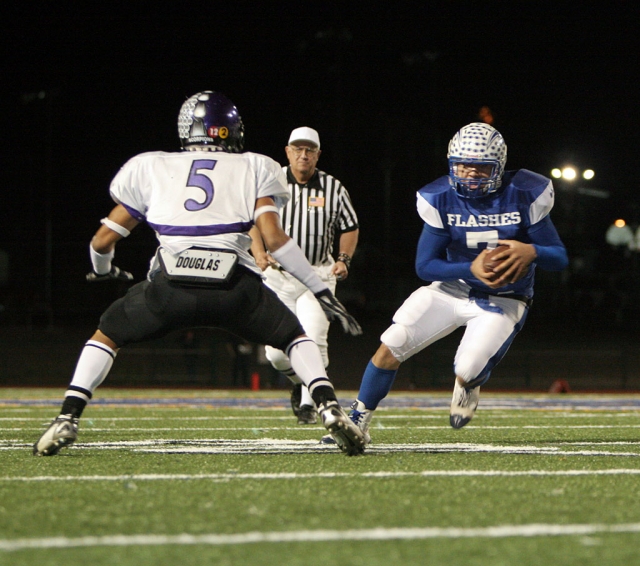 Quarterback Nathan Ibarra #7 runs the ball for yardage and is able to score. Ibarra had 2 touchdowns against the Scorpions.