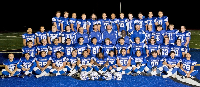Pictured above is the Fillmore Flashes football team: Back Row: Noah Aguirre, Brandon Barker, Victor Moreno, Kevin Brock, Mike Cervantes, Alberto Morales, Major Lee, Quinn Keller, Carson Lhotka, David Esquivel, Ricky Plazola, and Emilio Gomez. Third Row: Gerardo Alday, Jessie Sanchez, Bo Zinskey, Dylan Dawson, Coach Dave Wilde, Coach Matt Suttle, Head Coach Matt Dollar, Troy Eskridge, Coach Curtis Garner, Hector Munoz, Juan Carlos Toledo, Corey Cole, and Mike Vigil. Second Row: Anthony Cortez, Kelly Bullard, Paula Ruiz, Gabriel Manzano, Johnathan Munoz, Derek Luna, Ty Casey, Victor Gomez, Nathan Ibarra, Tate Suttle, Cody Jackson, and Christian Prado. Bottom Row: Anthony Edwards, Austin Davis, Anthony Solis, Ernie Holladay, Ralph Sandoval, Jose Estrada, Troy Hayes, Nick Paz, Rene Paz, Jose Rangel, Gabriel Gomez, Jose Gonzales, and Zach Golson.

It’s been 36 years since the Fillmore Flashes went to the semi finals. They traveled to 29 Palms but were defeated 27-21, in what you might call one tough but well played game. The Flashes never gave up and fought until the very end. The Flashes ended their greatest season in the 86 year history of the program with a 10 and 3 record, 3343 yards rushing (school record) and 1419 yards passing (school record) for a grand total of 4762 yards of total offense (school record). The Flashes scored 443 points (school record); Nathan Ibarra set a school record with 72 completions out of 142 attempts for 1419 yards. Noah Aguirre set a school record with 30 receptions for 521 yards; Jose “Froggy” Estrada had 62 of 65 PAT attempts (school record). The defense had a total of 1029 tackles 59 for a loss, 18 sacks, 11 interceptions, and 14 fumble recoveries. Christian Prado had a school record 181 tackles 15 for a loss. According to Coach Dollar “ It was a great year for the Flashes, 29 Palms was a physical athletic team with the toughest defense we faced all year, it is a hard loss
for us but the team should be nothing but proud of their hard work and effort it was a privilege coaching them.”