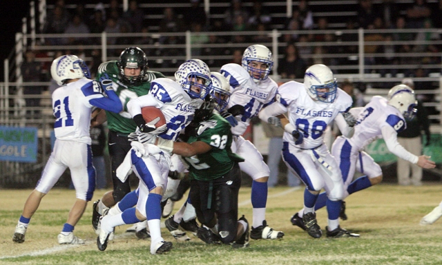 Ralph Sandoval tried to make his way through 29 Palms defense for some yardage. Sandoval had one touchdown in the game. Highlights - Nathan Ibarra was 9 of 20 for 200 yards and Christian Prado had 22 tackles in the first semifinals game since 1972..