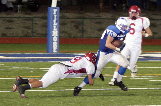 Christian Prado #40 had 13 tackles against Santa Paula. Above Prado runs the ball for a couple of yards.