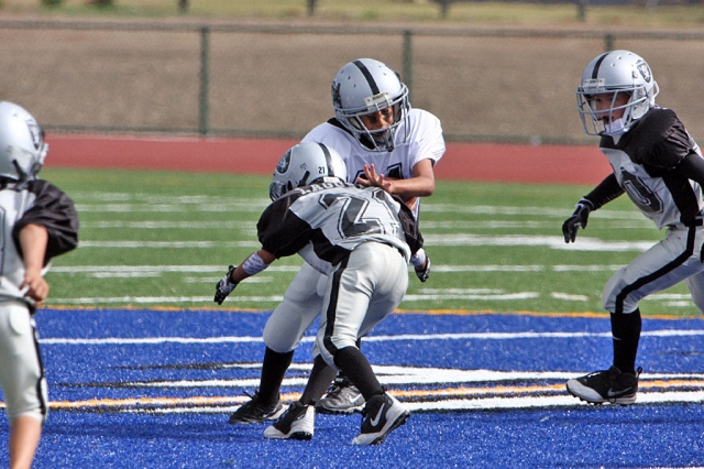 Miguel Lagunes attempts to bring down Pete Frias.