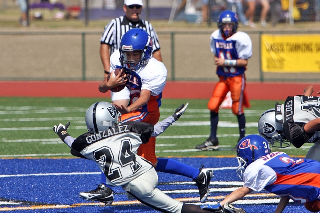 Damian Gonzalez attempts to bring down a Westlake ball carrier.