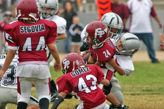 An Unknown Mighty Mite Silver Player takes down a Cardinal Runner.