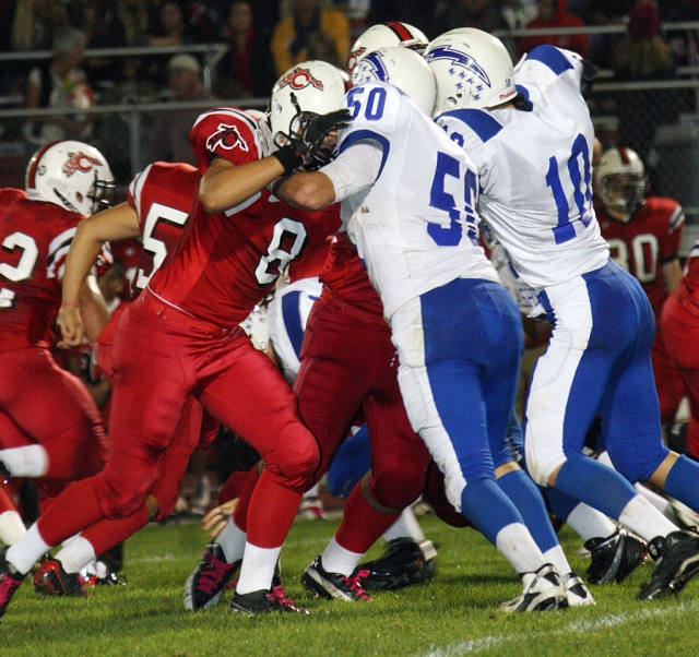 Johnny Wilber #50 and John Paul Galvez #10 defend Carpinteria.