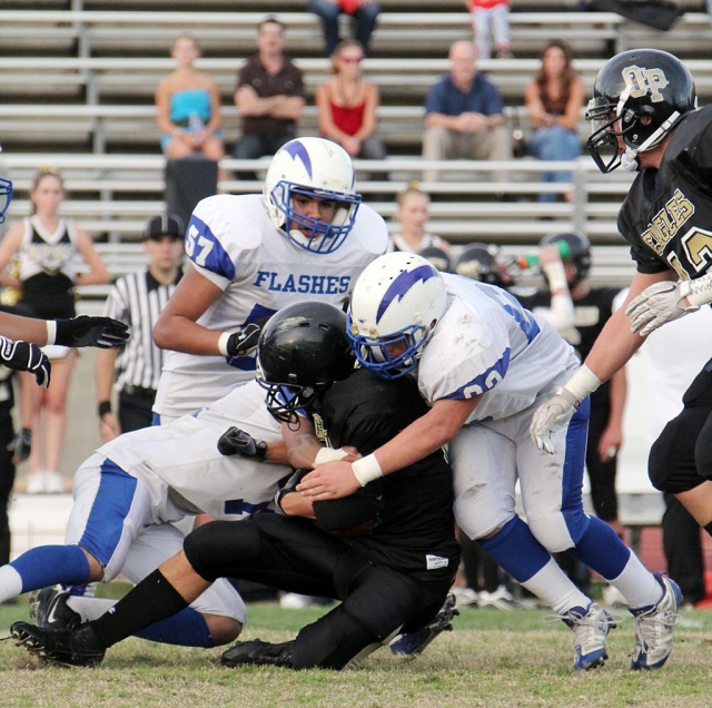 M.J. Moreno #57 runs over to assist his teammates on the tackle. On Defense Jeremy Martinez, Brett Edwards and Lalo Gomez played a great game.