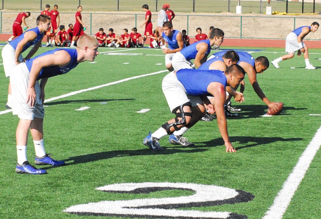 During the summer Flashes football participated in a 7 on 7 passing league. Last Thursday they competed against Oxnard. Above, varsity gets lined up for the play being called out by Robert Bonilla.