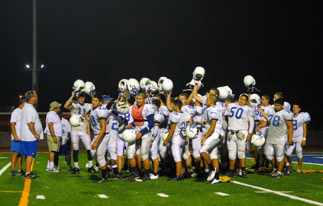 The Fillmore Flashes Varsity Football team held their first night practice last Wednesday on the new football field, underneath the new lights. The players seemed excited and proud to be on the field and one player stated that he ran faster on the new turf. Above, the players raise their helmets with a shout of “Flashes” before they end practice. The Flashes have their first home football game this Friday (J.V. 4:30 p.m.
& Varsity 7:30 p.m.) against Channel Islands...... Go Flashes!