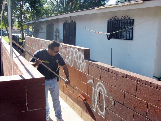 Deputy Cesar Salas painting over Graffitti in a walk way of the Lemon Way. A great example of the work the Fillmore gang officers do. More than just arrest criminals, they care for the community they serve. They take pride in preventing crime, and when they fail they clean it up.