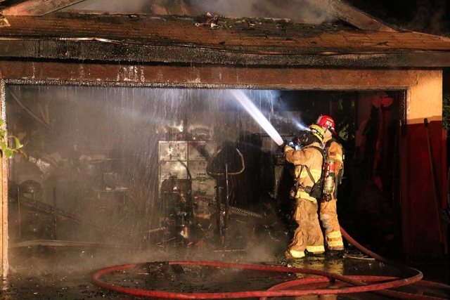 At 1:07am Fillmore Fire Department responded to the 200 block of Casner Way finding a garage fully involved with fire. FFD immediately asked for assistance from Ventura County Fire and Santa Paula Fire Departments attic fire crews. It took approximately 30 minutes to contain the fire. The fire was contained to the garage area. Due to the heavy smoke in the main structure two residents were displaced. Investigators did state that this was not fireworks related. Origin of the fire is under investigation. Photo by Sebastian Ramirez.