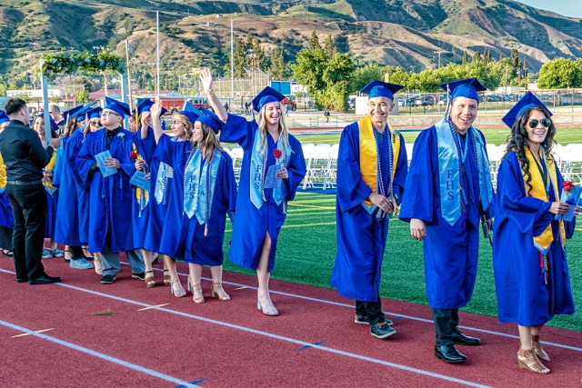 Fillmore’s 2019 Graduating Class marched onto the high school field for the last time on Thursday, June 6th, after their final bus ride. Two hundred and fifty-six seniors waved to family and friends, who packed the bleachers, as the FHS band played Pomp and Circumstance, directed by Greg Godfrey. Principle John Wilber welcomed the students and visitors before Susie Garcia sang the National Anthem. ASB President Ariana Schieferle led the crowd in the Pledge of Allegiance. Senior Class President Ricky Cadena, Valedictorian Damian Meza, and FHS teacher Debra Hoffman all spoke. Live music was performed by Mariachi Los Rayos, before the Presentation of Awards by District Superintendent Dr. Adrian Palazuelos. Presentation of Class was made by John Wilber, with Presentation of Diplomas by school counselors Ronda Reyes-Deutsch and Dena Wyand, and Board of Education members Scott Beylik, Kellie Couse, Virginia De La Piedra, Sean Morris, and Lucy Rangel. The school alma mater was performed by the FHS Band, and Tassel Ceremony was led by Salutatorian Andres Romero. Photos by Bob Crum.