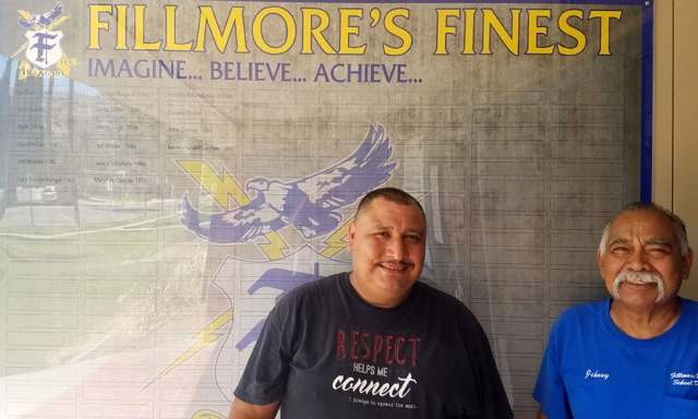 Pictured are Johnny Uribe and Baldo Magana who helped to put up the names of this year’s recipients. Photo courtesy FHS Staff.