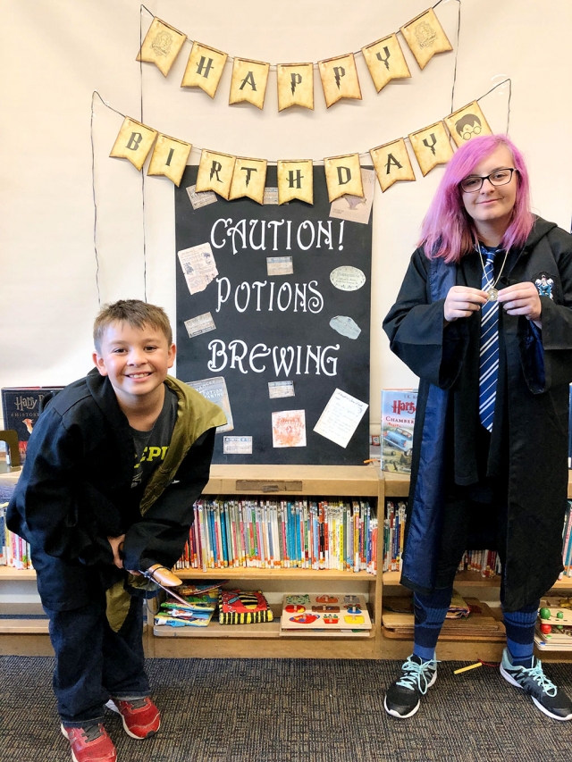 (above) Adrian and Kira Martinez, who came dressed up in their Hogwarts House robes for the party.