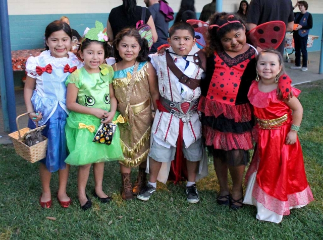 Kids (and some parents) dressed in their costumes and excitedly headed down to the free admission Harvest Festival at San Cayetano Elementary. After a few years’ hiatus, San Cayetano Elementary hosted the Harvest Festival which included food, games, and activities on Wednesday October 26th from 5pm-9pm. There was a very good turnout for it being the first year back. Pictured above are some of kids who dressed up to enjoy the festivites.