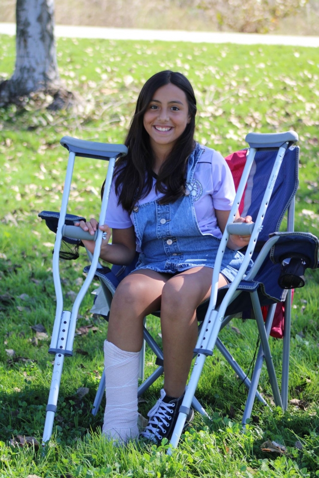 One minute you’re at soccer practice having fun and the next minute you’re in the emergency room getting a cast on your leg. That’s what happened to this AYSO soccer player last week at Two Rivers Park when she stepped into one of the numerous potholes on the park’s sports field and broke her ankle. For several years complaints have been increasing about the poor condition of the playing fields at Two Rivers Park, along with complaints about the lack of night lighting (estimate $1 million in 2016) and sun covers for the play equipment, as installed at Rio Vista Park. The dog park section (original cost $64,000) also has issues, closing in 2020 due to ADA violations. In April 2023 the city received an estimate of $186,240 to fix the violations, which were “overlooked” when the park was built, according to City Manager Dave Rowlands in July 2020; that money will come from the city’s parkland development impact fees fund. From the beginning the underground drip system was a problem. Either the drip lines are too deep or the sod was planted too shallow, and the water doesn’t properly reach the roots of the grass, leaving brown patches. In contrast, after rain, standing water plagues the fields due to poor drainage caused by uneven terrain. Two Rivers Park is about 15 years old and measures 22 acres; it is Fillmore’s biggest park and the host to many of its youth sports activities. It has baseball diamonds, soccer and football fields, a skate park, a BMX bike track, and a now unusable dog park. The family will be filing an incident report with the City/AYSO.