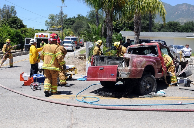 County and city fire departments responded to a traffic collision in the 1400 block of Grand Avenue, Tuesday. The call was received at approximately 12:05 p.m.. The driver and passenger of a small Ford pickup were extracted from the overturned vehicle after it had demolished a concrete residential wall. Both individuals were transported to a local hospital by ambulance. The extent of injuries and cause of the crash were not available at press time.