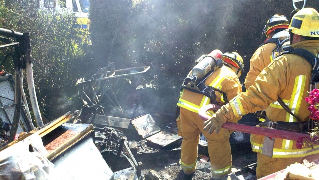 The cause of the fire was determined to be due in part to improper disposal of burnt paper materials. 