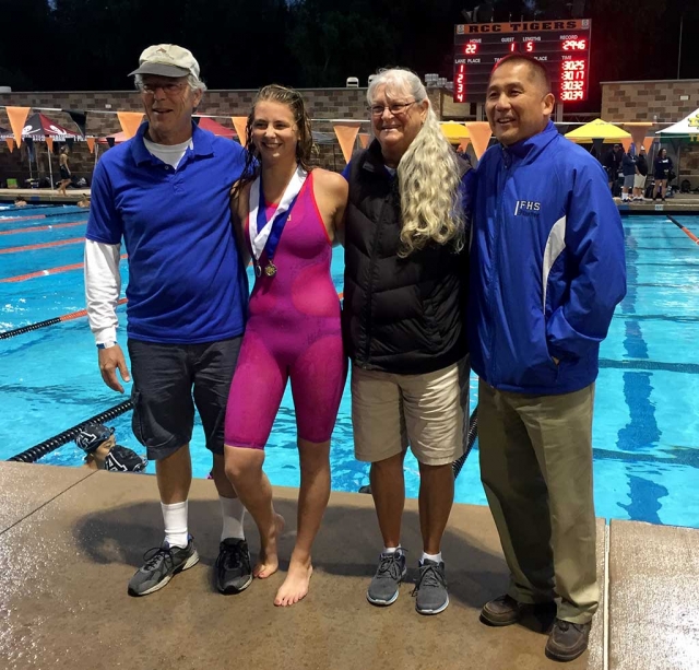 Katrionna Furness won the 2018 Division 4 100-backstroke title at the California Interscholastic Federation (CIF) games last Friday in Riverside. Kat is the first swimmer in Fillmore High School’s (FHS) history to win a CIF championship in the sport. She also placed 3rd in the 100 Freestyle. Pictured (right to left) at the CIF Finals are FHS Principal Tom Ito, Swim Coach Cindy Blatt, Katrionna, and Swim Coach Mike Blatt.