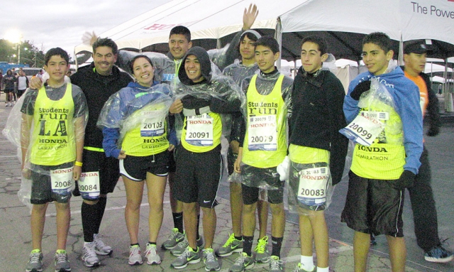 The Fillmore 8 participated in the March L.A. Marathon. Pictured at the side of the starting line, Dodger Stadium, in front of one of the sponsors tent, Honda. Nico Frias, Joel Frias, Carina Silva, Jovani (Geo) Rubio, Sammy Martinez, Isaac Gomez, Vincent Chavez, Alexander Frias and Anthony Rivas.