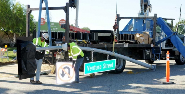 Workers installing new traffic light at Mountain View and Highway 126.