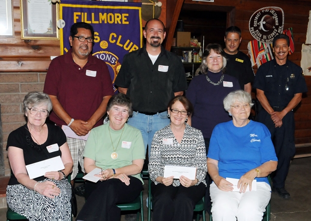 Fillmore Lions Club presented several groups donation’s at last Monday’s meeting: Fillmore Senior Center $1000. – President Donna Volker and VP Allan Hair, Fillmore Historical Society $1000. – President Martha Gentry and Nancy Bowlin, Boys and Girls Clubs of Santa Clara Valley - $1000. – Sheila Tate CEO, Fillmore High School Grad Night Live $1000 – Raelene Chaney, Fillmore Band Boosters $1000. – Eddie Carrillo, President, Fillmore High School $1000. Friends of the Fillmore Library $500. Patti Walker, President and Iris Martin, Treasurer, Fillmore Athletic Department $500. A banner displayed at all home games affirms their support for sports. Look for it at football, soccer, track, basketball and softball games. Also supplied by the Lions Club were CPR and first aid materials for health class which is taken by all students. Additionally materials will be used to certify staff members. The Fillmore Lions Club invited some of the community organizations they support to attend the club’s Monday, October 17, 2011 meeting where they were recognized and honored for their continuing effort to work with and encourage our citizens to make Fillmore continue to evolve and be the best it can be. Pictured above standing (l-r): Eddie Carrillo, Josh Overton, Patti Walker. Sitting (l-r): Donna Volker, Martha Gentry, Sheila Tate, and Raelene Chaney. Also pictured are Vic Gongora and Al Huerta.