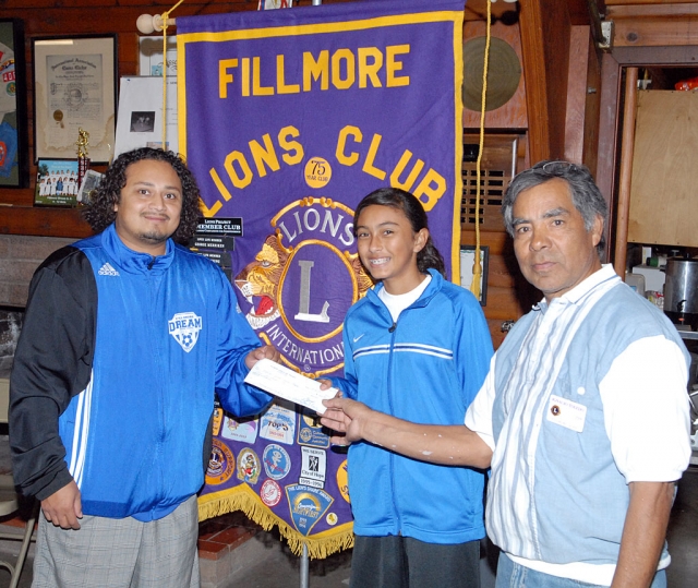 At Monday night’s Lion Club meeting The Fillmore Dream Soccer Team received a $300 donation. Lion Ignacio Toledo presented the check to coach Jose Vaca and player Reyleen Martinez.