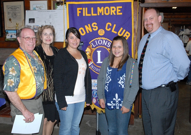 (l-r) Lion Ken Mittan, Mrs. Doris Nichols, mother of the winner, Calista Godfrey, and Fillmore Middle School Principal Mr. Schweller. Godfrey was the winner of this years poster contest.