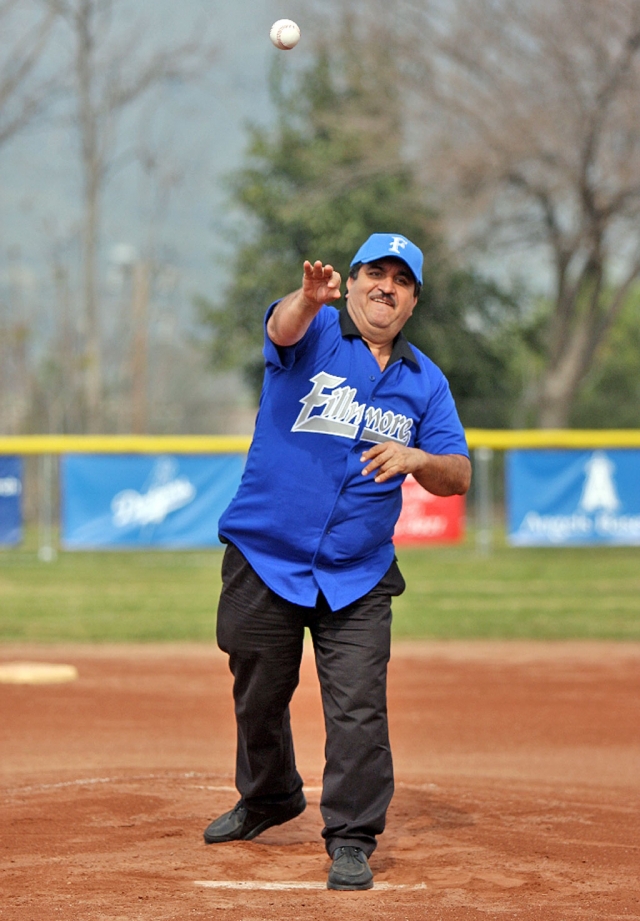 Chuy Ortiz owner of El Pescador restaurant threw out the first pitch during Fillmore Little League’s opening ceremonies last Saturday.