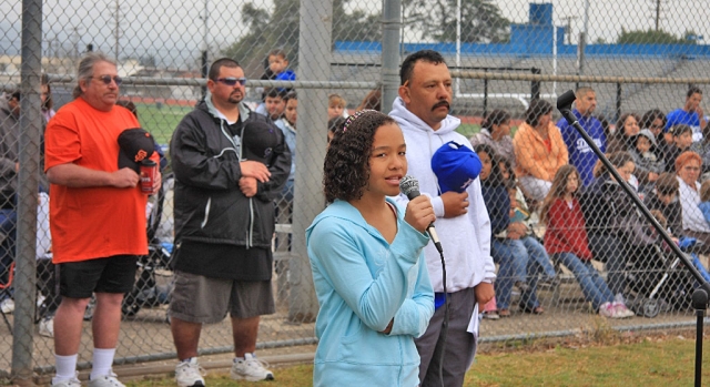 Amber Wilmont sang the National Anthem at Little Leagues opening ceremonies. Also pictured Mickey Wilmont, Armando Tello, and David Lugo.