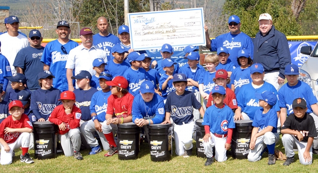 Last Saturday Fillmore Little League held their “Opening Ceremonies,” they also kicked off a big fundraiser with the help of WM. L. Morris Chevrolet. Above Chappy Morris presents a check to Fillmore Little League for $500.