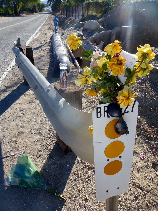 A memorial marks the sight of Saturday night’s shooting.
