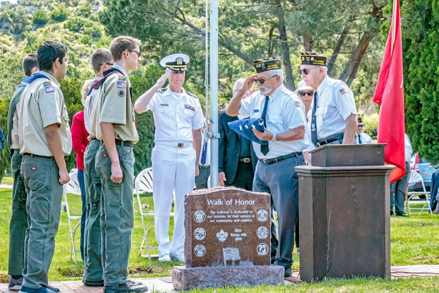 The Bardsdale Cemetery held its Memorial Day Ceremony on Monday, May 27th at 11 a.m. The Ceremony began with a fly-over by the 805th Navion Squadron. Opening remarks were by Lynda Edmonds, Board of Trustees. Pledge of Allegiance by Boy Scout Troop #406, and Cub Scout Troop #3400. This year’s featured speaker was Captain Douglas W. King, Civil Engineer Corps, Chief Staff Officer Naval Base Ventura County. Capt. King is a Seabee Combat Warfares Specialist, Warranted Contracting Officer and Acquisition Professional Community member. He has been awarded the Navy Meritorious Service Medal (four awards), Joint Service Commendation Medal, Navy Commendation Medal (four awards), Navy Achievement Medal and other awards. He is married and has three daughters. The Reverend Bob Hammond of St. Stephens Anglican Church gave the Memorial Service, and special music was provided by the Bardsdale Methodist Church Choir, and Cub Scout Troop 3400. Presentation of Colors was Veterans of Foreign Wars, Fillmore Post 9637, Tom Ivey and Ismael Alonzo. Placing of the Wreath by Dmitri Gurkweicz. Also assisting in the ceremony was VFW Post 9637, Boy Scout Troop 406, Cub Scout Troop 3400 and Bob Thompson. The Boy Scouts put out the flags on Friday, May24th, and they were picked up by the Bardsdale 4H on Tuesday, May 28th. Reading of Names of Those Who Died in the Service of our Country was led by Jim Rogers. Taps was by Bill Morris. A special thank you to Garcia Mortuary for furnishing the doves to conclude the service, and to the P.E.O. for furnishing cookies. The Board of Trustees of the Cemetery District is as follows: Gabe Asenas, President, Lynda Edmonds, Secretary, Rita Rudkin, and Kathryn Wren Gavlak; Manager Doug Basolo, staff Damian Foster. Photos courtesy Bob Crum.