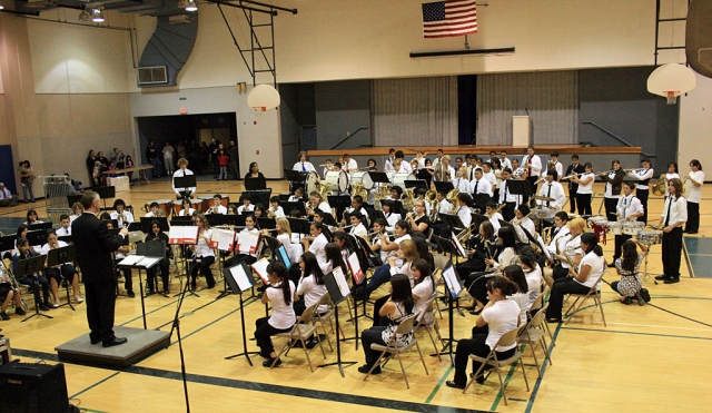 Fillmore Middle School Band held their spectacular Winter Concert on Wednesday, Dec. 10, 2008, directed by Mr. Greg Godfrey. The first performance was by the 21 Beginning Band students who played short selections from their “Standard of Excellence” book. Next, the Intermediate Band members played four rousing marches. These 45 band members are all second and third year musicians. Finally, the 84 members of Advanced Band performed six complex pieces including The Star Spangled Banner , Night on Bald Mountain, and Halo 3. For the grand finale, members of all three groups (shown in attached picture) joined to play Deck the Halls, which they also performed in the Lion’s Christmas Parade on Saturday, Dec. 6th. Thanks to the musicians and Director Greg Godfrey for a fantastic performance!