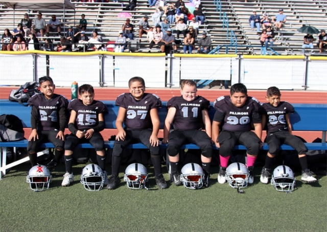 The Fillmore Raider team is made up of first year players, ages 6-8 year old. Head Coach Gene Cabral, along with Assistant coaches Jake Ellis, Tony Rodriquez, Manny Romero, Ricky Gonzales, Jess Rivera, Nathan Page and Vidal Romero have worked with the boys all season, leading the team to big wins. Their hard work paid off. The Raiders are now undefeated 7-0 for the season and will compete in their first playoff game this Saturday. You can catch the boys in their 1st playoff game against Valley Rush on Saturday, October 29th, at 8am at Fillmore High School Football Stadium. 
Team Season Game Stats: 8/27/22 – vs. Valley Rush (28-14) 9/03/22 – vs North Valley (12-0) 9/10/22 – vs. Newbury Park (30-8) 9/17/22 – vs. 805 Warhawks (26-12) 10/01/22 – vs. 805 Warhawks (30-0) 10/15/22 – vs. Simi Valley (28-0)