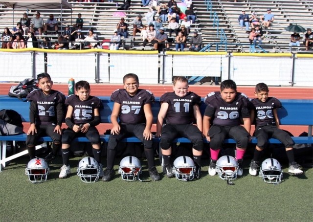 The Fillmore Raider team is made up of first year players, ages 6-8 year old. Head Coach Gene Cabral, along with Assistant coaches Jake Ellis, Tony Rodriquez, Manny Romero, Ricky Gonzales, Jess Rivera, Nathan Page and Vidal Romero have worked with the boys all season, leading the team to big wins. Their hard work paid off. The Raiders are now undefeated 7-0 for the season and will compete in their first playoff game this Saturday. You can catch the boys in their 1st playoff game against Valley Rush on Saturday, October 29th, at 8am at Fillmore High School Football Stadium. 
Team Season Game Stats: 8/27/22 – vs. Valley Rush (28-14) 9/03/22 – vs North Valley (12-0) 9/10/22 – vs. Newbury Park (30-8) 9/17/22 – vs. 805 Warhawks (26-12) 10/01/22 – vs. 805 Warhawks (30-0) 10/15/22 – vs. Simi Valley (28-0)