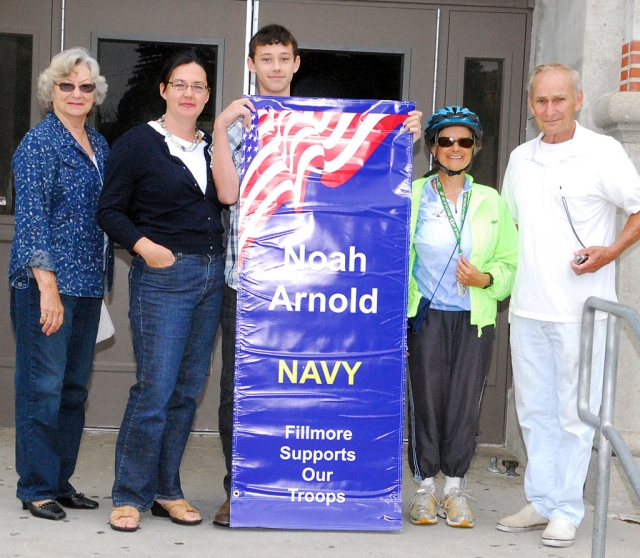 Noah Arnold family members proudly display his banner.
