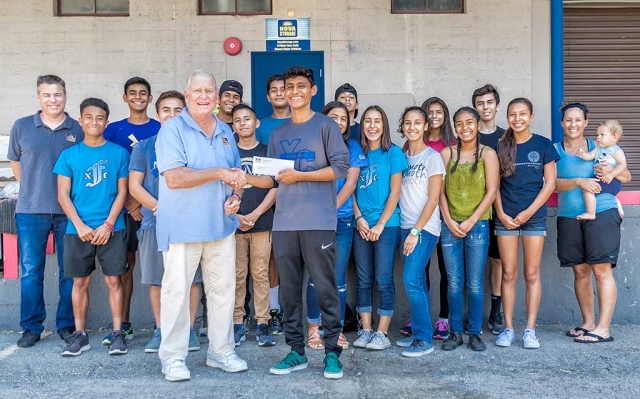 On Wednesday, July 19th Nova Self Storage owner Larry Layne presented a $250 donation to the Fillmore High School Cross Country team. They had heard about the teams trip through a letter to the editor that had been published in the Fillmore Gazette by teammate Vanessa Avlia, and reached out to donate to the team. The check will go toward sthe teams upcoming Mammoth Lake 8 day trip. Where the team will train like the professional runners and create strong bonds with thier teammates. Photo courtesy of Bob Crum.