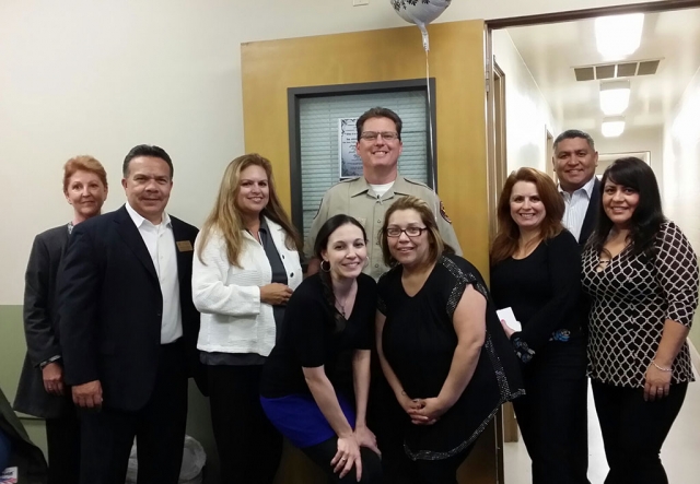 Officer Thomas Brown, center back, is shown with members of the Fillmore Chamber of Commerce.